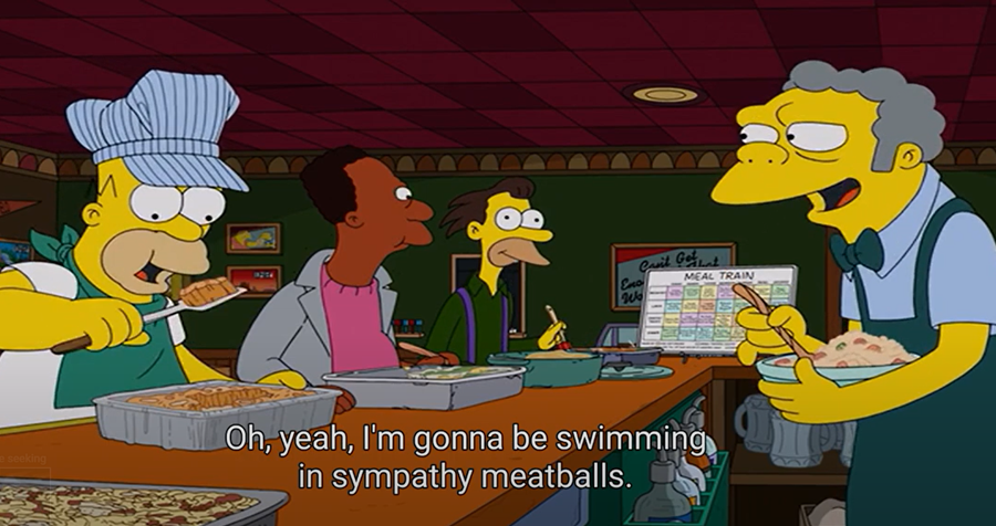 Homer eating meatballs.